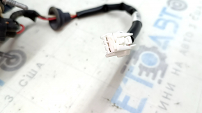 The left inner tailgate light for a Nissan Rogue 17-20 is worn.