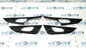 A set of door panel trims for the Nissan Rogue 16-20 in carbon fiber, gloss finish.