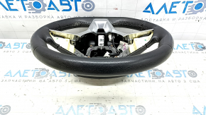 The steering wheel is naked, leather, black, and heated. Nissan Rogue 19-20