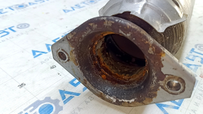 The Lexus RX450h 16-22 catalytic converter is sawed off and rusty.