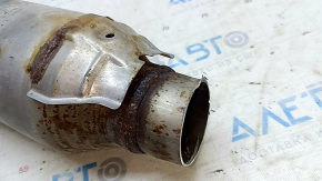 The Lexus RX450h 16-22 catalytic converter is sawed off and rusty.