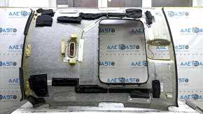 The headliner of the Audi A3 8V 15-16 4d is black, under the sunroof, dented, torn.
