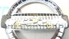 The Nissan logo emblem on the tailgate of a Nissan Leaf 18-22 has broken guides.