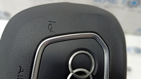 The Audi Q3 83A 19-25 steering wheel airbag, black, scratches