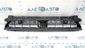 The lower grille of the front bumper of the Audi Q3 83A 19-23 for parking sensors and radar, S-Line, is broken, cracked, a fragment is missing
