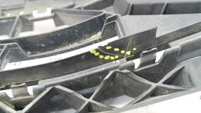 The lower grille of the front bumper of the Audi Q3 83A 19-23 for parking sensors and radar, S-Line, is broken, cracked, a fragment is missing