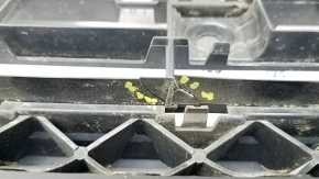 The lower grille of the front bumper of the Audi Q3 83A 19-23 for parking sensors and radar, S-Line, is broken, cracked, a fragment is missing