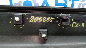 Lower rear left door trim for Mazda CX-5 17-24 in color, broken fasteners, scratches