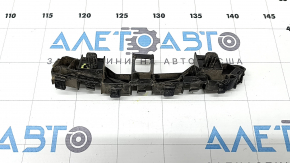 The front bumper mount on the right fender of a Honda Accord 13-17 is broken.