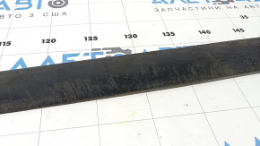 The front bumper lip of a 1993 Honda Accord is worn.