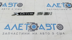 Emblem inscription "X Drive 28i" on the trunk door of the BMW X1 F48 16-18