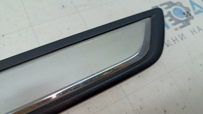 A set of black door sill plates for the Mazda CX-5 17-25 with a chrome insert and backlight, scratches