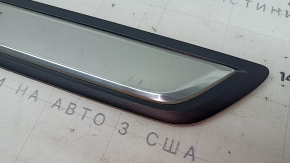 A set of black door sill plates for the Mazda CX-5 17-25 with a chrome insert and backlight, scratches