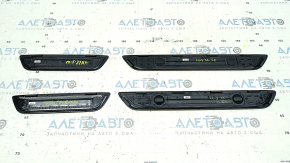 A set of black door sill plates for the Mazda CX-5 17-25 with a chrome insert and backlight, scratches