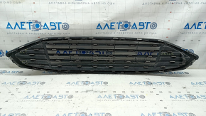 The grille assembly with frame for Ford Fusion mk5 2017-2018 is sand-painted and the mount is broken.
