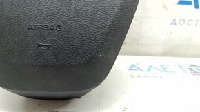 Black, scratched steering wheel airbag for the driver's side of a Ford Fusion mk5 17-20.