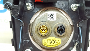 Black, scratched steering wheel airbag for the driver's side of a Ford Fusion mk5 17-20.