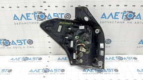 Right headlight for a 17-18 SJ Subaru Forester with wiring, broken glass, and a defective reflector.
