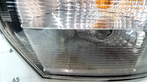 Right headlight for a 17-18 SJ Subaru Forester with wiring, broken glass, and a defective reflector.