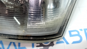 Right headlight for a 17-18 SJ Subaru Forester with wiring, broken glass, and a defective reflector.