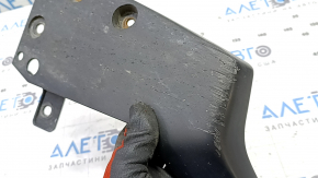 The left rear bumper lip of a Toyota Prius 30 10-15 is worn out.