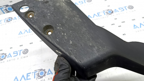 The right rear bumper lip of a Toyota Prius 30 10-15 is worn out.