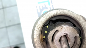 The lower front right control arm of a Jeep Cherokee KL 20-23 has a torn silent block.