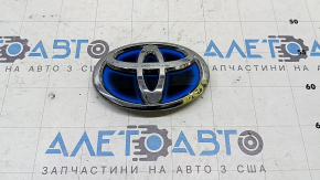 The Toyota Prius 30 10-15 trunk door emblem has peeled off the chrome.