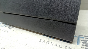 Black dashboard trim panel for the driver's knees of a VW Tiguan 18-24, with a trim panel, scratches