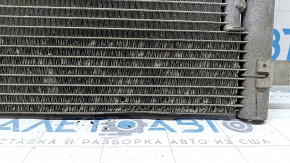 The air conditioning radiator condenser of the VW Tiguan 18-24 Keihin is dented, bent, and the honeycombs are falling out.