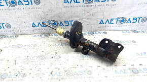 Rusty front left shock absorber for a 1995 Subaru Legacy