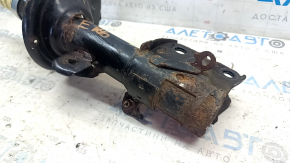Rusty front left shock absorber for a 1995 Subaru Legacy