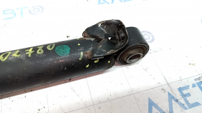 The rear left shock absorber of a Hyundai Santa FE Sport 17-18 restyling FWD is dented.