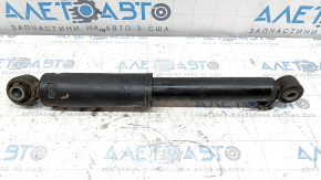 The rear left shock absorber of a Hyundai Santa FE Sport 17-18 restyling FWD is dented.