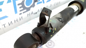 The rear right shock absorber of a Hyundai Santa FE Sport 17-18 restyling FWD is dented.