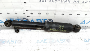 The rear right shock absorber of a Hyundai Santa FE Sport 17-18 restyling FWD is dented.