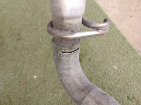 The exhaust line, middle part with a barrel, Jeep Grand Cherokee WL 23-25 3.6 long, under 1 exhaust, is dented, burst, the bracket is torn off.