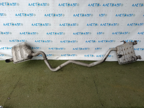The exhaust line, middle part with a barrel, Jeep Grand Cherokee WL 23-25 3.6 long, under 1 exhaust, is dented, burst, the bracket is torn off.