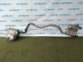 The exhaust line, middle part with a barrel, Jeep Grand Cherokee WL 23-25 3.6 long, under 1 exhaust, is dented, burst, the bracket is torn off.