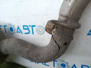 The exhaust line, middle part with a barrel, Jeep Grand Cherokee WL 23-25 3.6 long, under 1 exhaust, is dented, burst, the bracket is torn off.