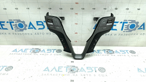 The steering wheel controls on a Hyundai Santa FE Sport 2017-2018 restyling have worn trim and broken fasteners.