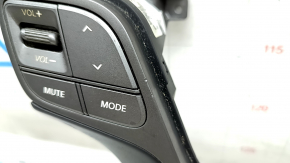 The steering wheel controls on a Hyundai Santa FE Sport 2017-2018 restyling have worn trim and broken fasteners.