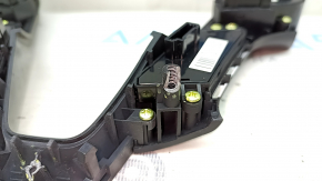 The steering wheel controls on a Hyundai Santa FE Sport 2017-2018 restyling have worn trim and broken fasteners.