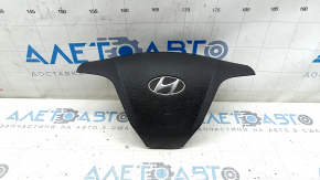 The steering wheel airbag for the driver's side of the Hyundai Santa FE Sport 13-18 is black and rusty.
