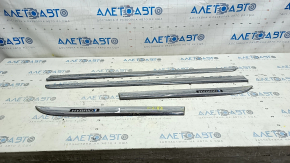 A set of lower door moldings for Toyota Prius 30 10-15 chrome, the chrome is swollen