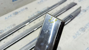 A set of lower door moldings for Toyota Prius 30 10-15 chrome, the chrome is swollen