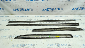 A set of lower door moldings for Toyota Prius 30 10-15 chrome, the chrome is swollen