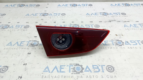 Mazda 3 19-22 4D left inner trunk lid light for polishing