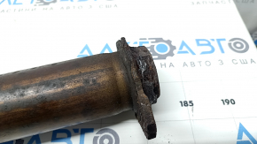 The Subaru Outback 15-18 exhaust pipe with catalytic converter is rusty.