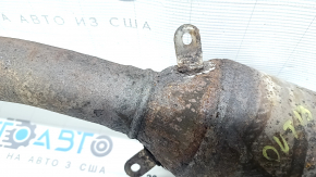 The Subaru Outback 15-18 exhaust pipe with catalytic converter is rusty.